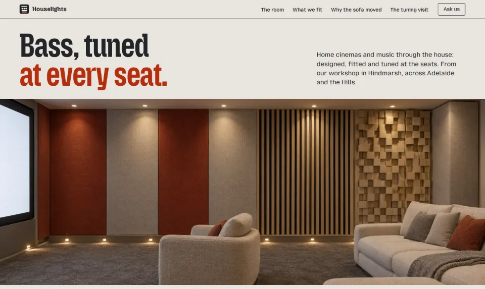 The treated side wall of a cinema room seen straight on, from the glowing screen past vermilion felt, oak slats and a diffuser to the sofa, under the headline