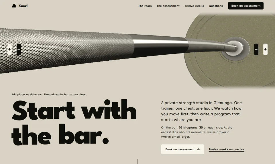 The front page: a chalked barbell very close across a pale chalk ground, loaded with olive plates, above a heavy headline