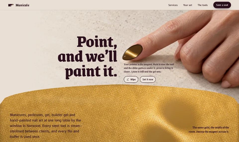 The front page: a pointing hand on limestone, its gold cat-eye nail lit by a line, over a full-width swatch of gold gel