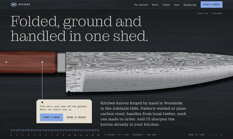 The front page: a pattern-welded chef's knife across a steel bench, the headline above its spine