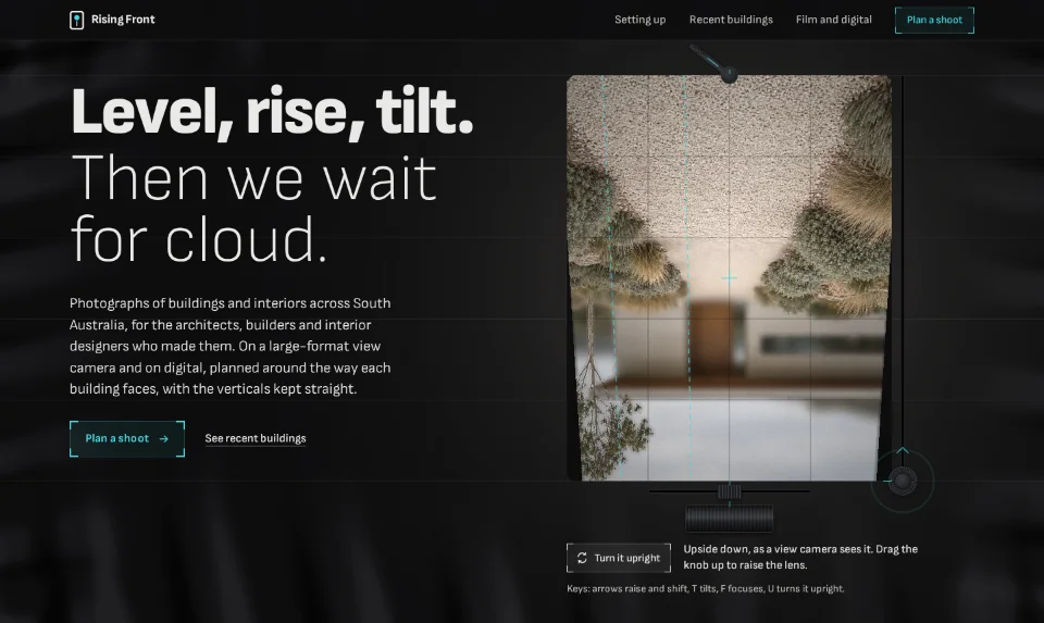 The front page: a concrete house upside down on a view camera's ground glass, the headline on black cloth