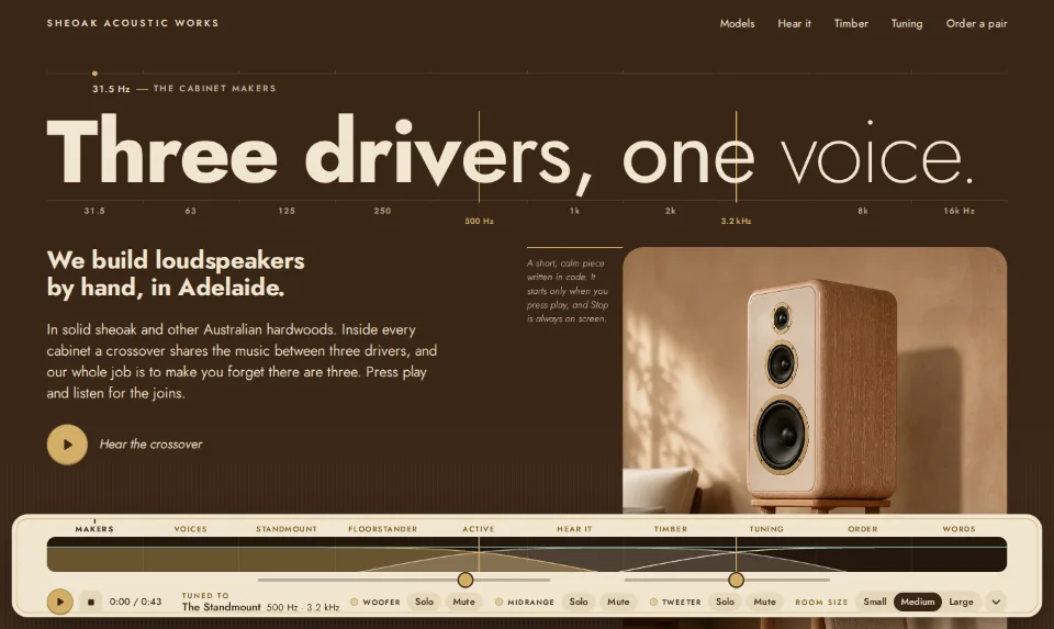 Sheoak Acoustic Works' front page: 'Three drivers, one voice.' set heavy to light across a frequency scale, above a cream console