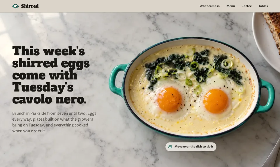 The front page: shirred eggs in a turquoise enamel dish from above on a marble counter, beside a heavy slab headline