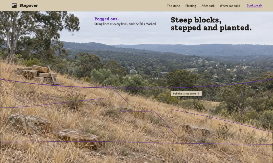 The front page: a steep bare Hills block marked out with pegs and string above a valley, a small slab headline in the sky